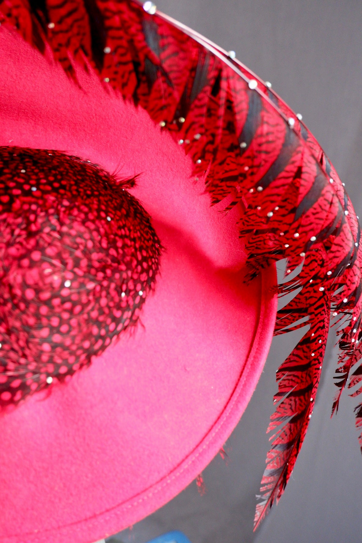 Vintage Jack McConnell Red Feather Hat – Sculptural Couture with Spotted Plumage and Rhinestone Trim