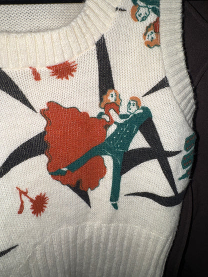 Front of a cream Pandora knit sweater vest with a red and teal dancing couple