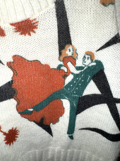 Close-up of the Art Deco ballroom dancers knit into a cream Pandora sweater vest