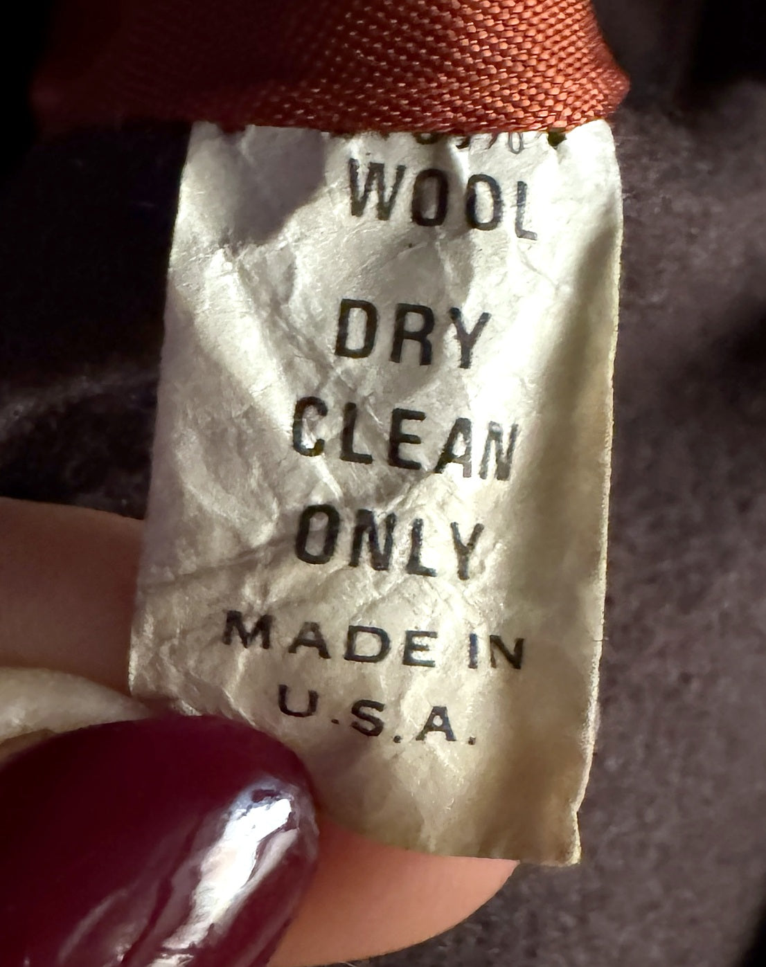 Wool, dry clean only, Made in USA care label on a Brittany coat
