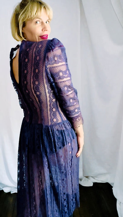 Unedited back view of a plum lace dress with keyhole back and zipper, showing true color