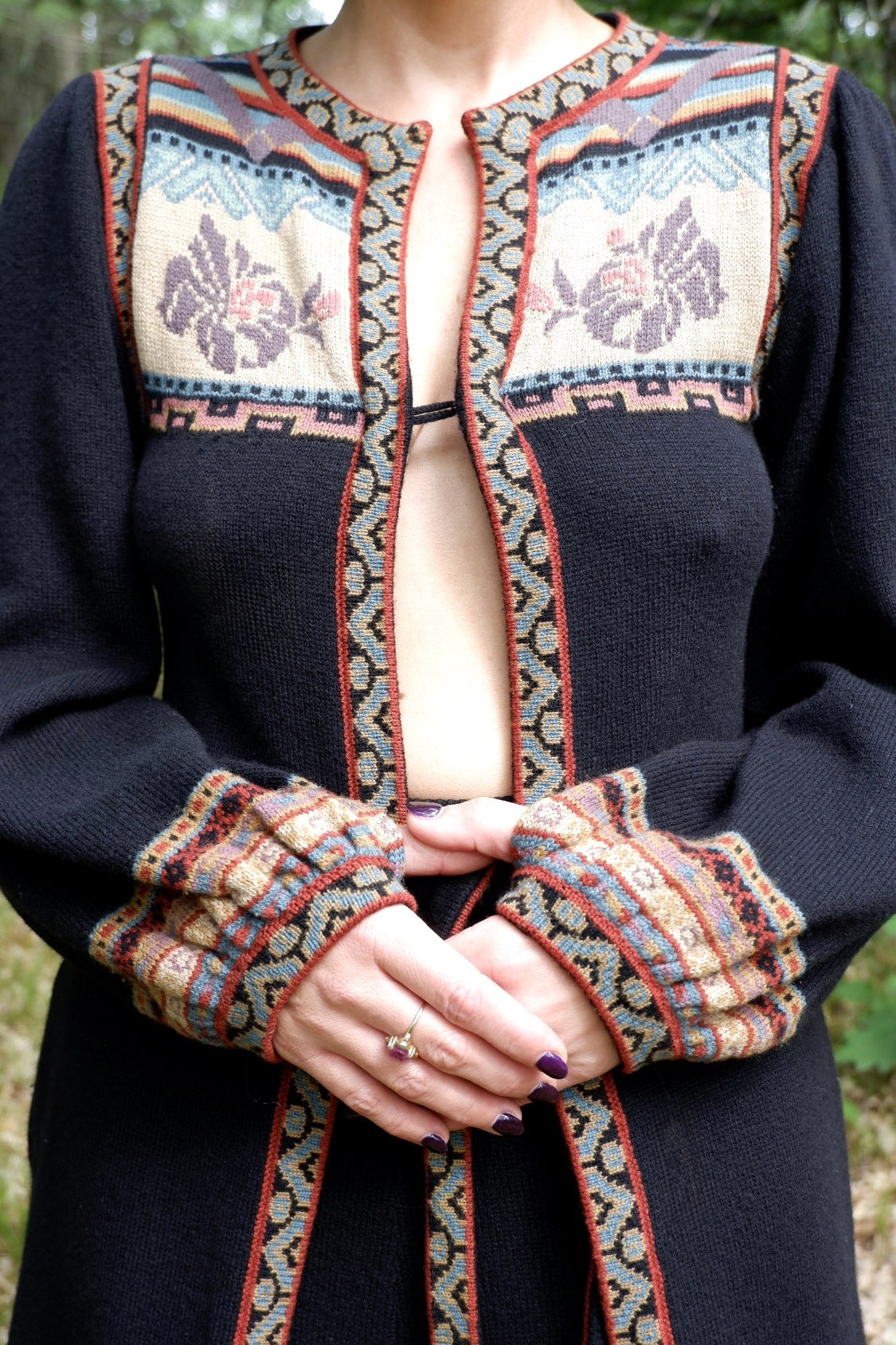 Close-up of the John Ashpool duster's intarsia floral yoke and patterned balloon-sleeve cuffs