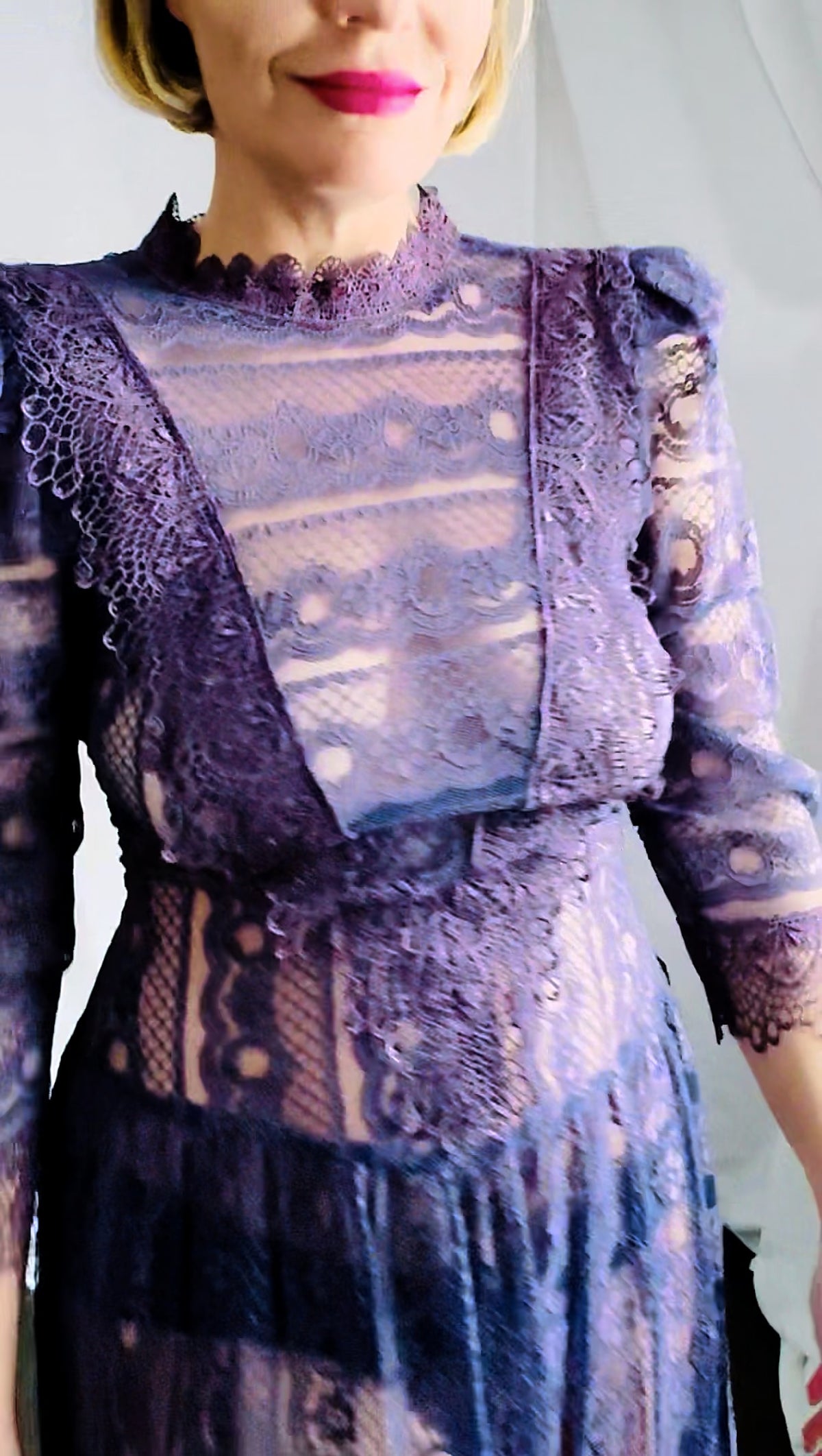 Unedited close-up of the sheer plum lace bodice and guipure V panel, showing true color