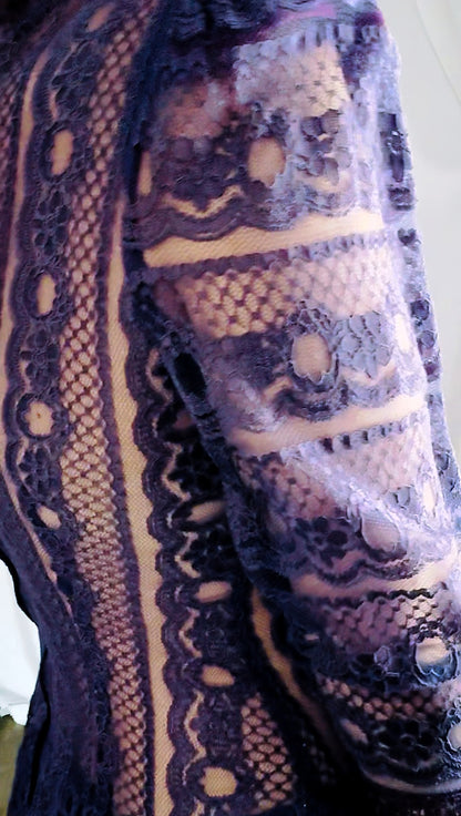 Unedited close-up of the layered plum lace sleeve and netting, showing true color