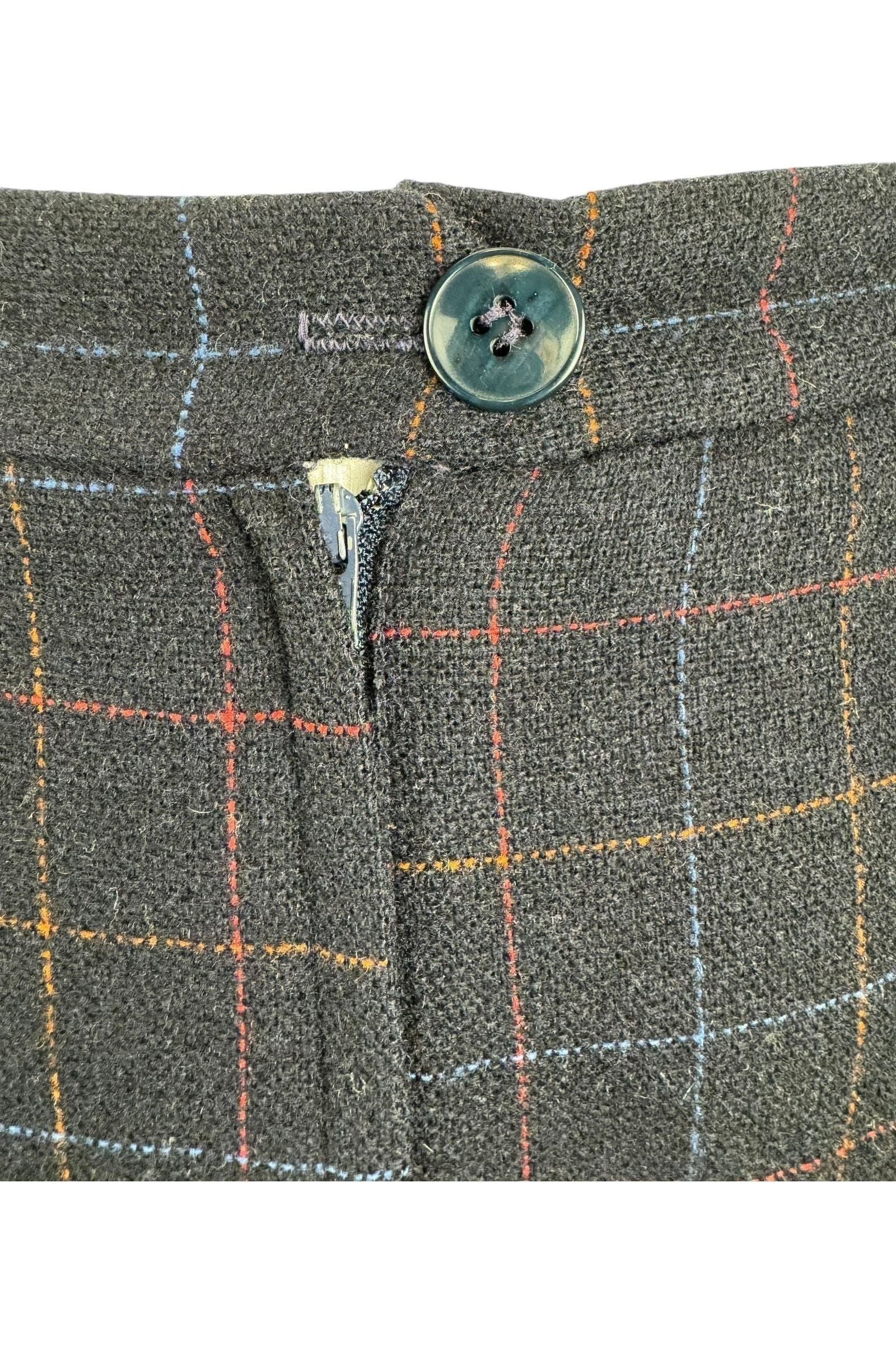 close up detail on 1950s Frostmann wool skirt made Louisberg Square. featuring pleats and a multicolor check pattern