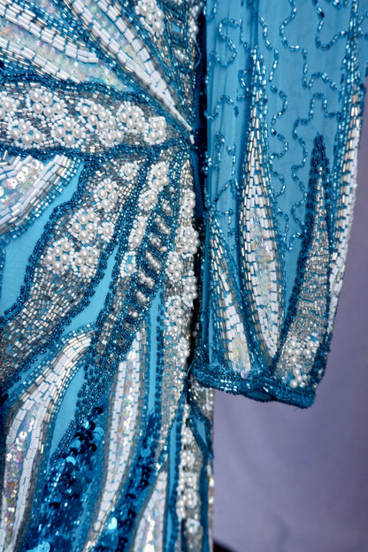 Detail of hand-sewn pearl clusters and beaded sleeve cuff on vintage turquoise gown