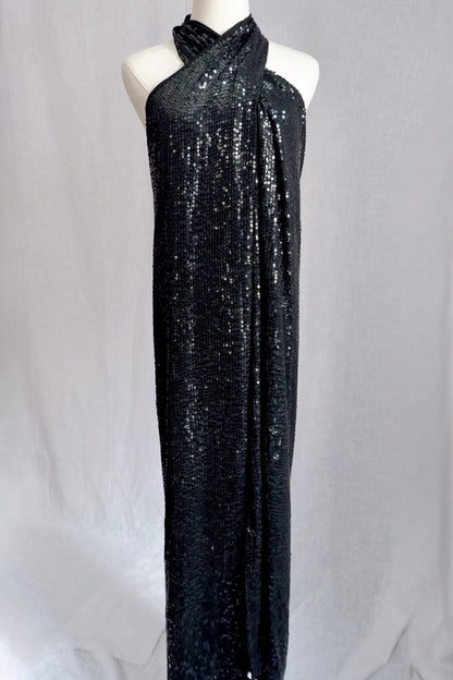 Vintage 1990s Donna Karan New York black sequin wrap halter gown, front view on dress form