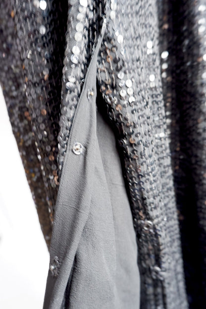 Inner snap closures along the wrap edge of Donna Karan sequin gown