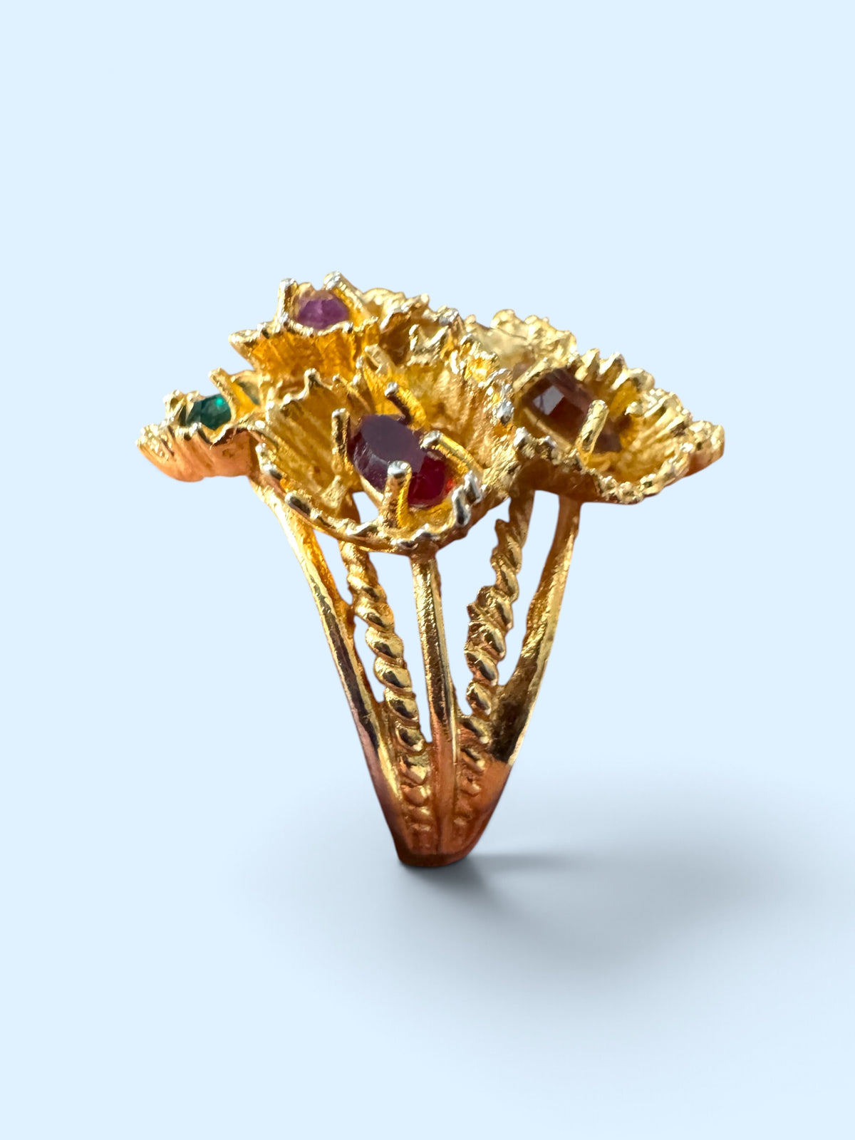 Side profile of vintage ESPO cocktail ring showing high-set flower cluster on open split rope-twist shank