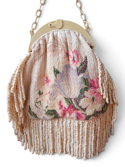 Back of the Gallery of Wearable Art handbag, floral tapestry with fringe