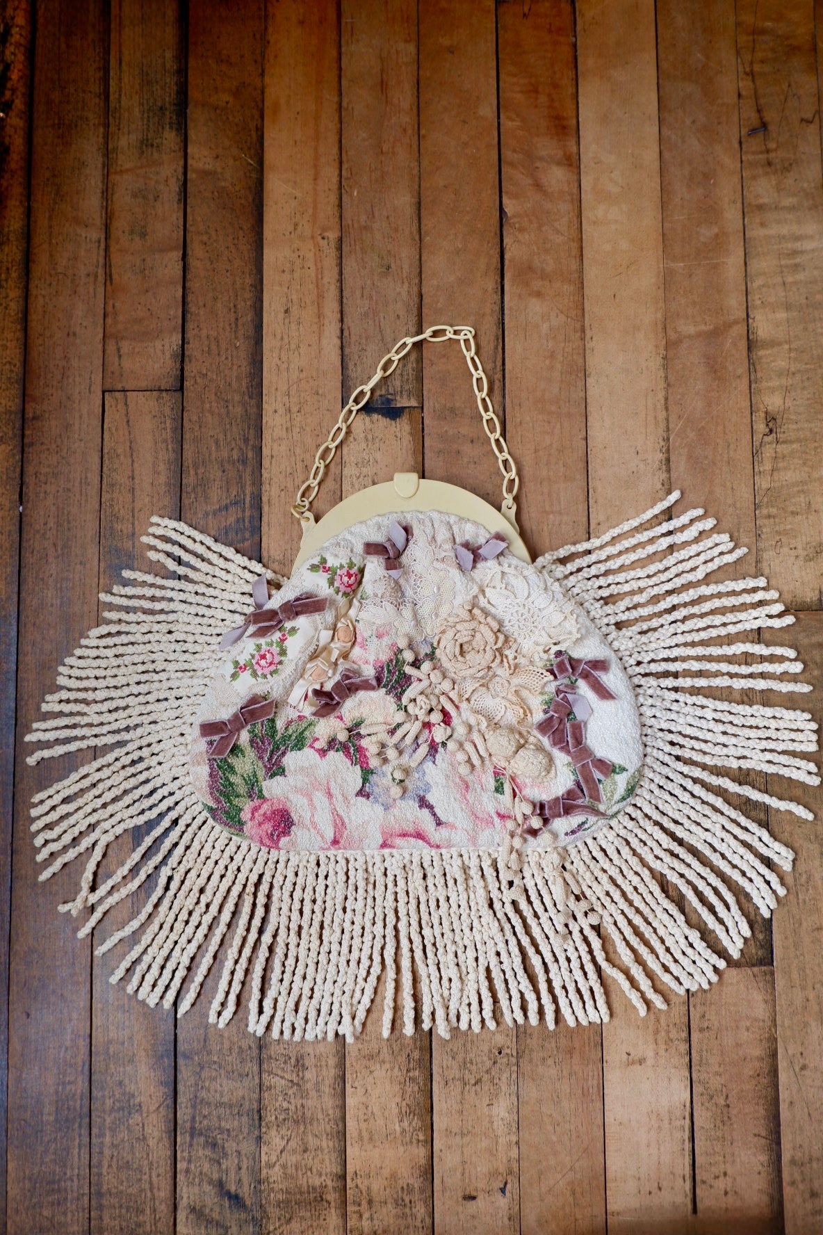 Gallery of Wearable Art handbag laid flat with fringe fanned out