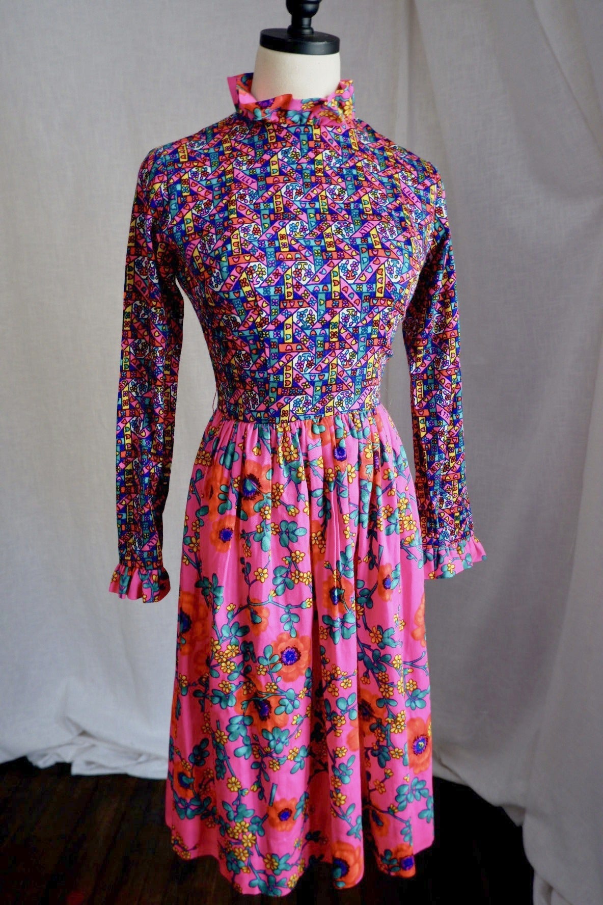 Vintage 1960s The Lilly Lilly Pulitzer hot pink mixed-print dress with ruffle collar, front view on dress form