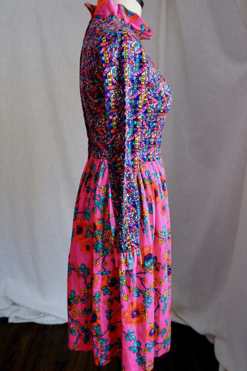 Side view of vintage Lilly Pulitzer mixed-print dress showing fitted bodice and full gathered skirt