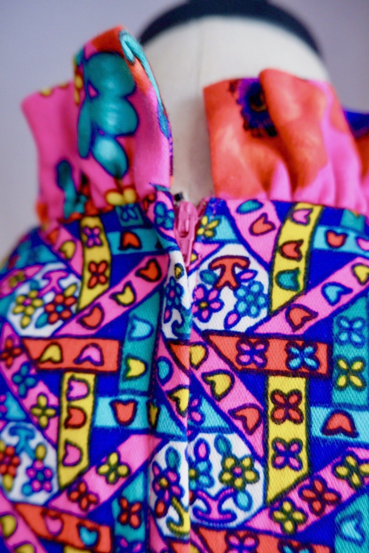 Close-up of pink back zipper and ruffled floral collar on vintage Lilly Pulitzer dress
