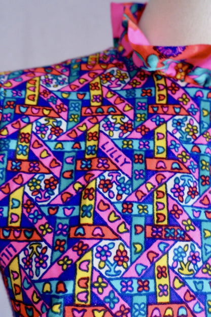 LILLY signature hidden in the stained-glass heart and flower print of vintage Lilly Pulitzer dress