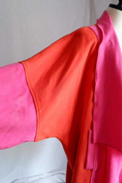 Close-up of orange shoulder and pink sleeve seam on Merle Chicago wool coat