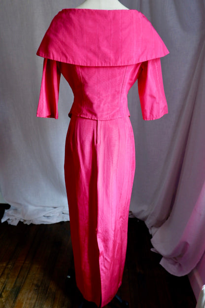 Back view of hot pink moiré set showing wide portrait collar and skirt back slit
