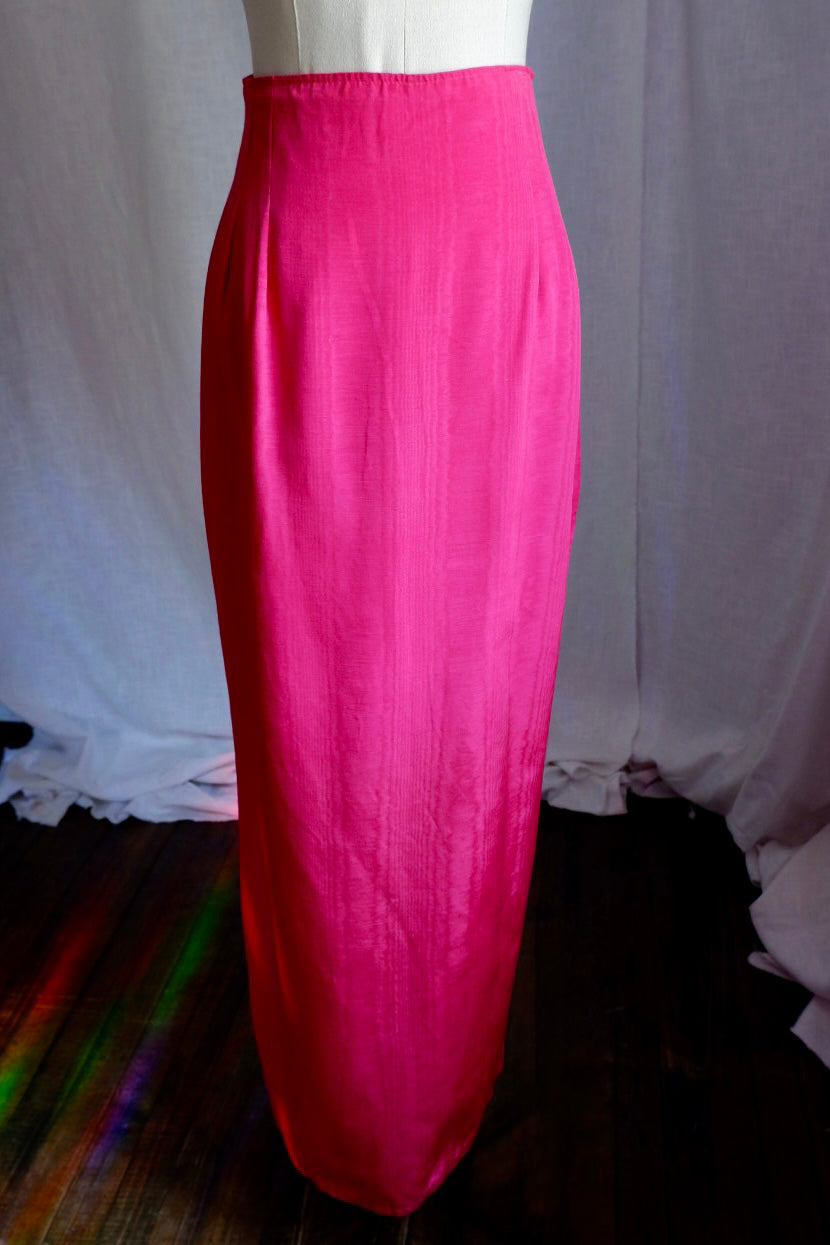 Hot pink moiré high-waisted floor-length column skirt on dress form, front view