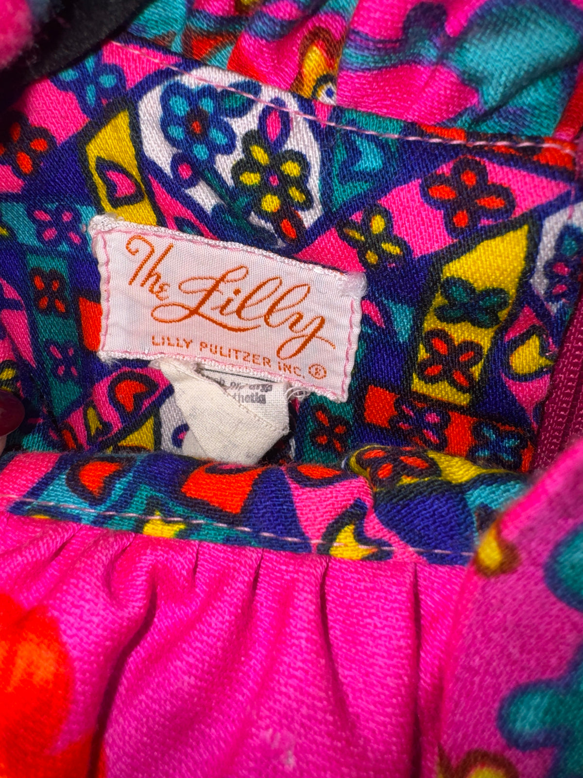 The Lilly, Lilly Pulitzer Inc. label in orange script inside vintage 1960s mixed-print dress