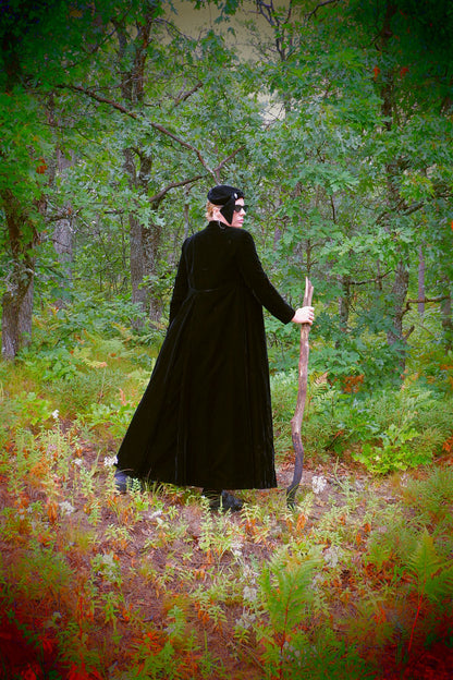 Black velvet opera cape showing gathered back and full sweep